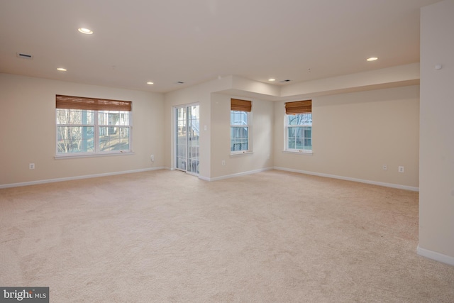 empty room featuring light carpet