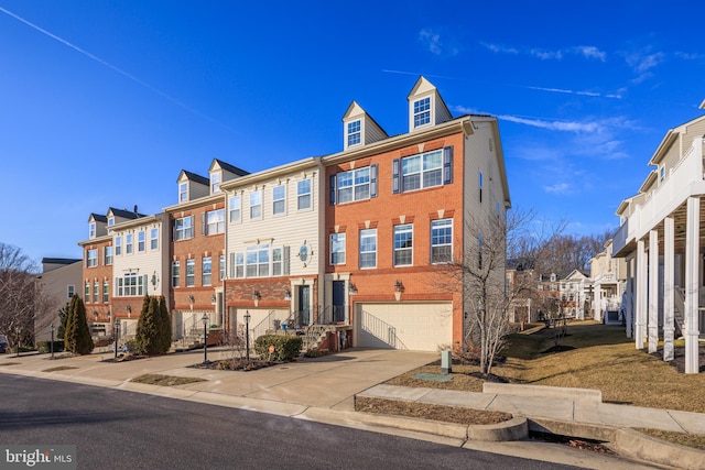 multi unit property featuring a garage