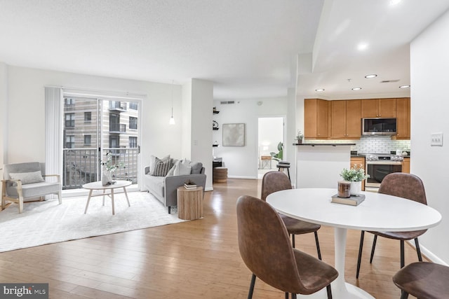 dining room with hardwood / wood-style floors