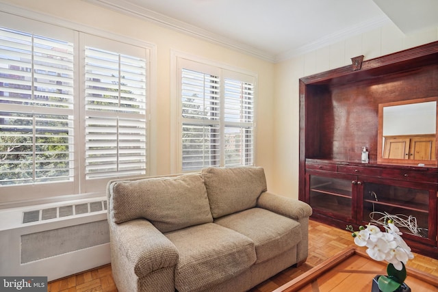 living area featuring ornamental molding, radiator, and parquet floors