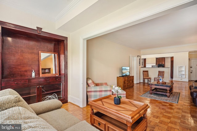 living room with ornamental molding and light parquet flooring