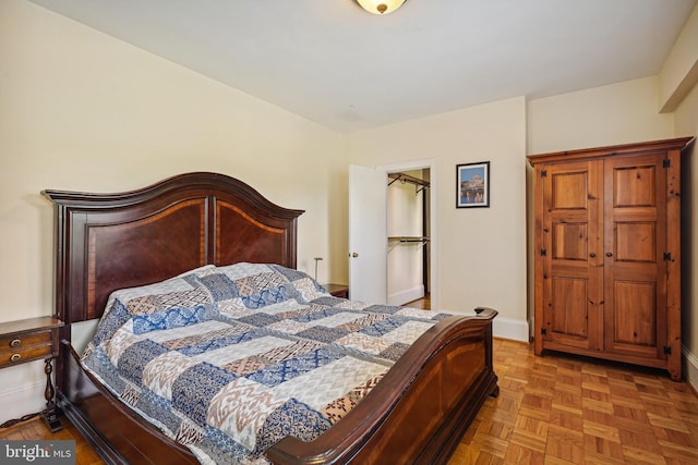 bedroom featuring light parquet flooring