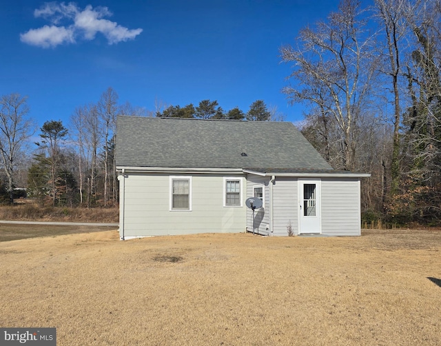 rear view of house with a lawn