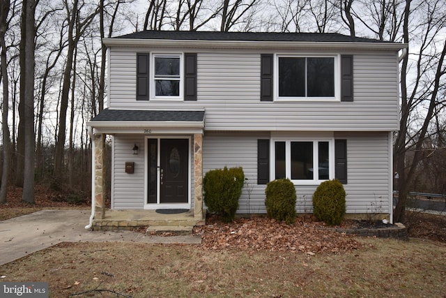 view of front of property with roof with shingles