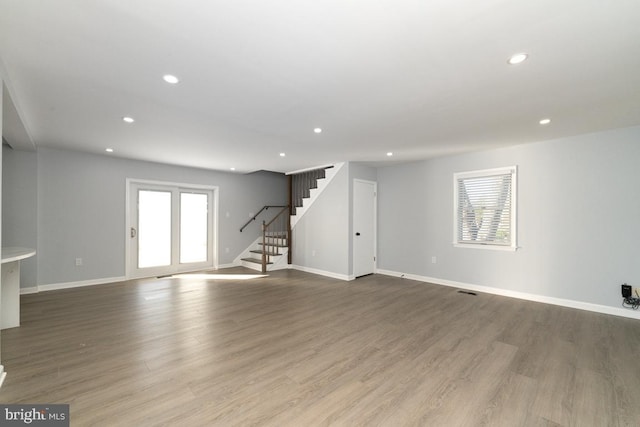 unfurnished living room featuring light hardwood / wood-style flooring