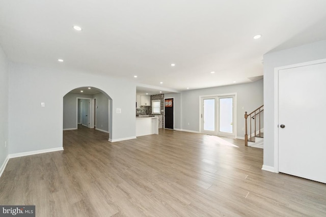 unfurnished living room featuring light wood-type flooring