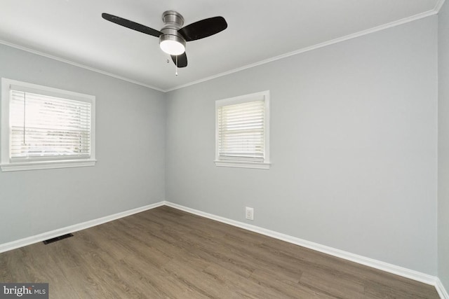 spare room featuring crown molding, hardwood / wood-style floors, and ceiling fan