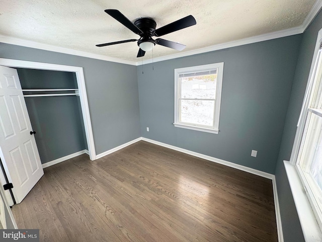 unfurnished bedroom with hardwood / wood-style floors, a textured ceiling, a closet, and ceiling fan