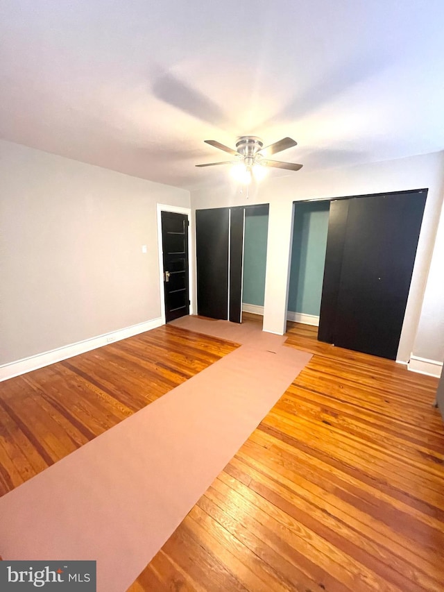 unfurnished bedroom with hardwood / wood-style flooring and ceiling fan