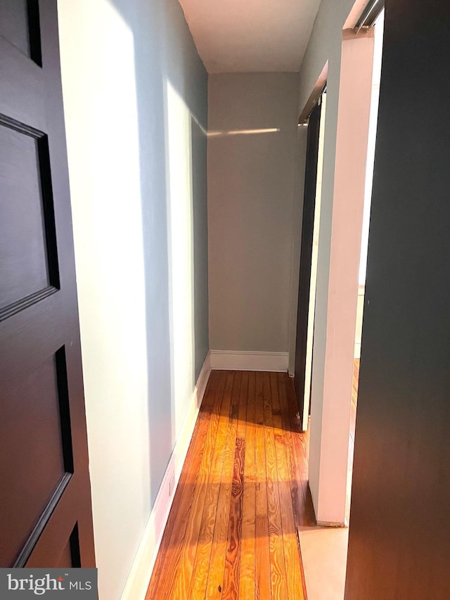 hallway featuring light hardwood / wood-style flooring