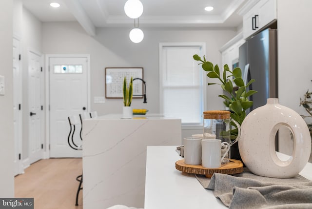 washroom featuring light hardwood / wood-style flooring and ornamental molding