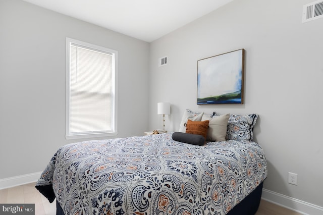 bedroom featuring hardwood / wood-style floors