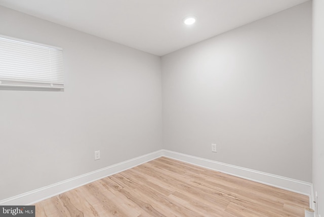 spare room with hardwood / wood-style flooring