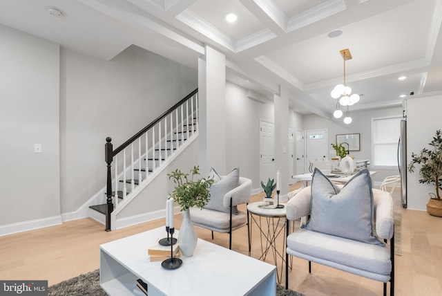 living room with beamed ceiling, ornamental molding, coffered ceiling, and light hardwood / wood-style floors