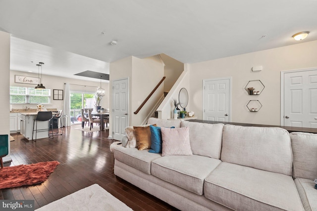 living room with dark hardwood / wood-style flooring