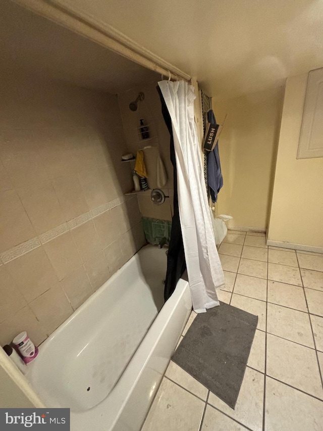 bathroom featuring tile patterned floors and shower / bath combination with curtain