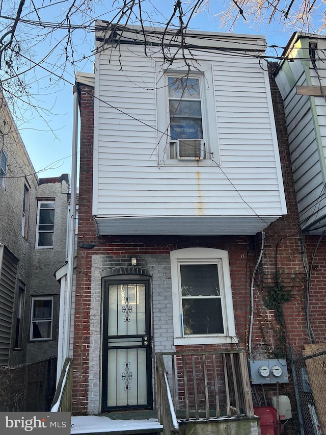 view of front facade featuring cooling unit