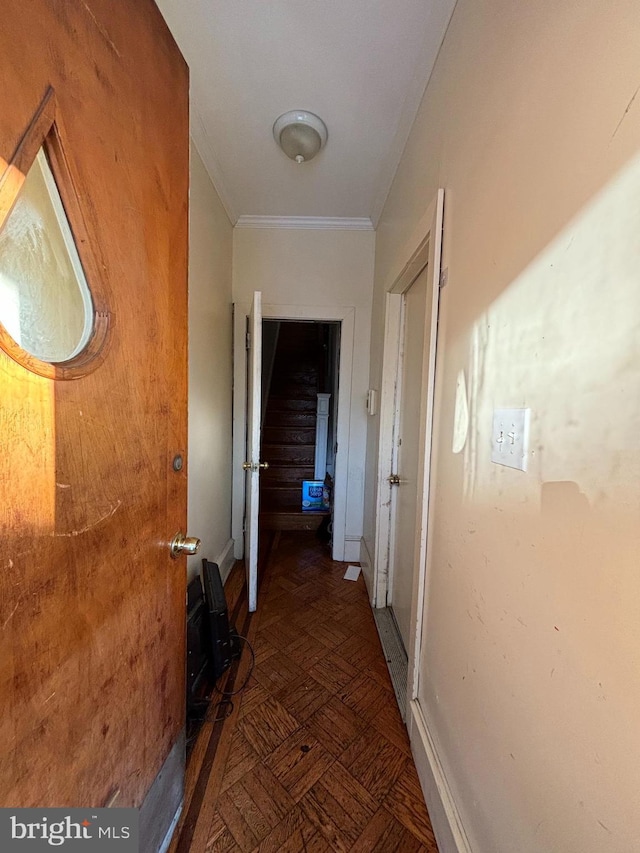 corridor featuring crown molding and dark parquet floors