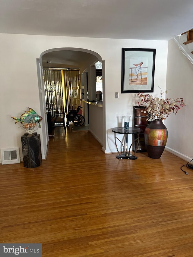 hallway with wood-type flooring