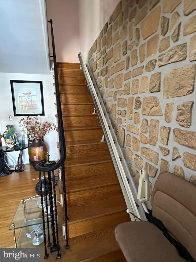 stairway featuring hardwood / wood-style floors