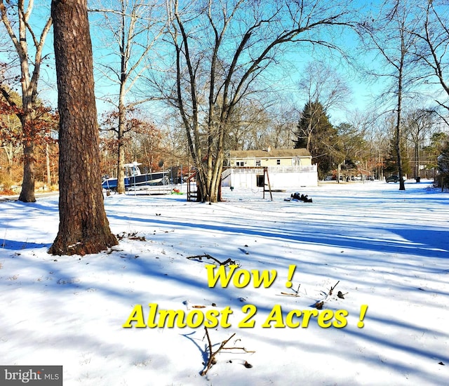 view of yard layered in snow