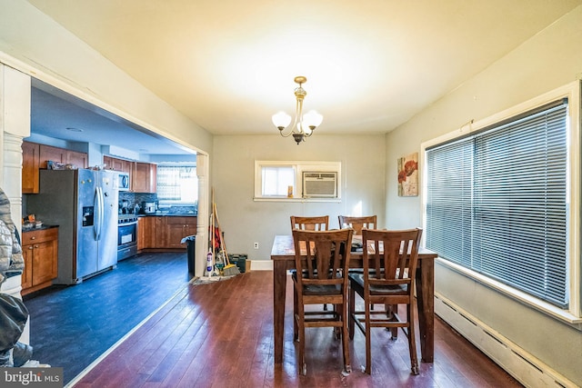 dining space featuring a baseboard heating unit, a notable chandelier, dark wood-type flooring, and a wall mounted AC