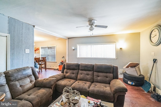 living room featuring a baseboard heating unit, hardwood / wood-style floors, and ceiling fan