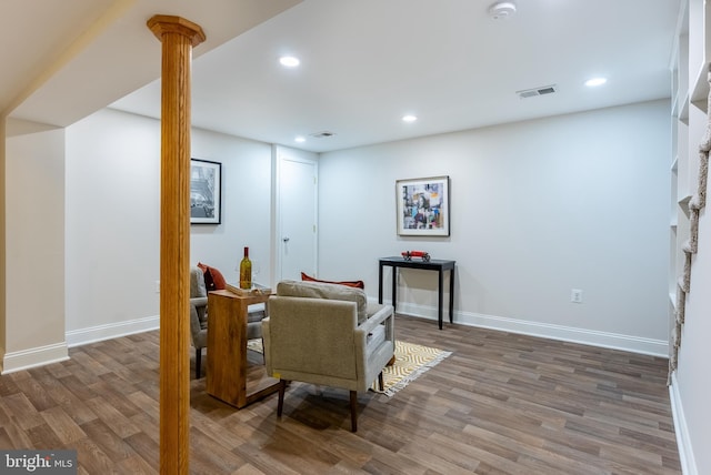 sitting room featuring recessed lighting, wood finished floors, visible vents, and baseboards