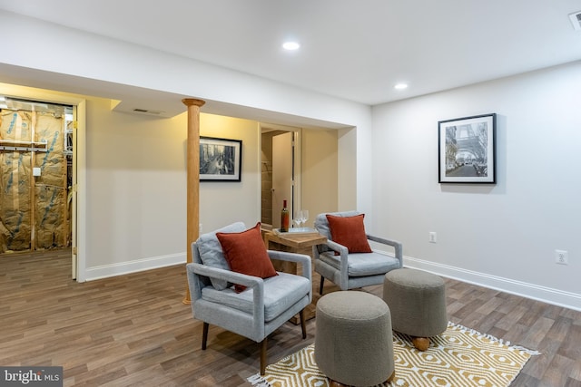 sitting room featuring recessed lighting, baseboards, and wood finished floors