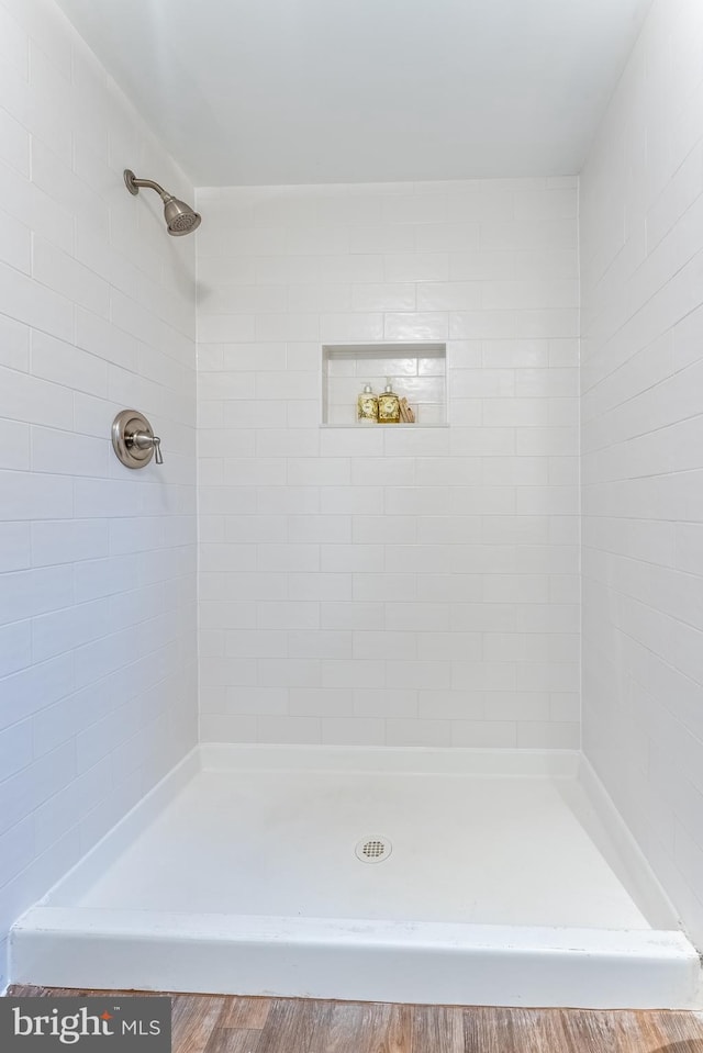 bathroom with a tile shower