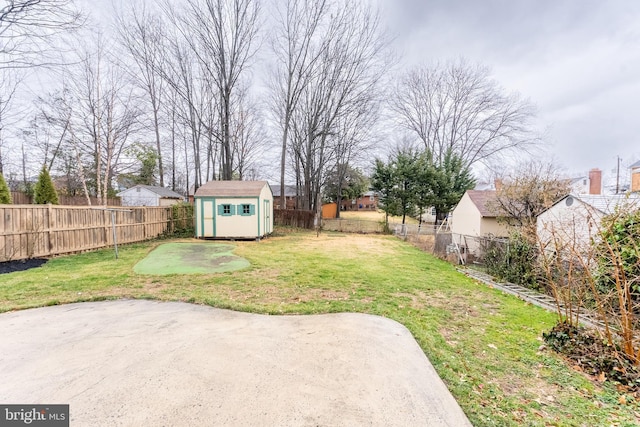 view of yard with a patio area, a shed, a fenced backyard, and an outdoor structure