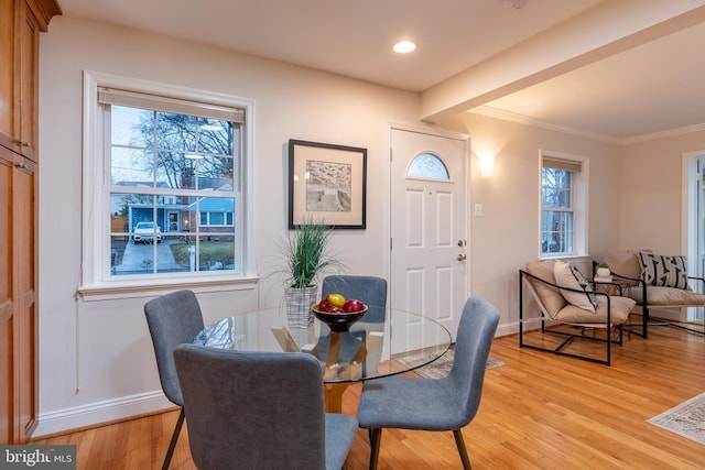 dining room with baseboards, a wealth of natural light, and light wood-style floors