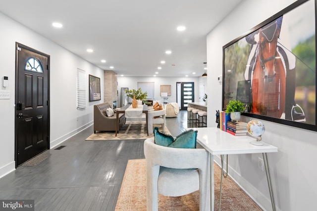 living room with dark hardwood / wood-style flooring