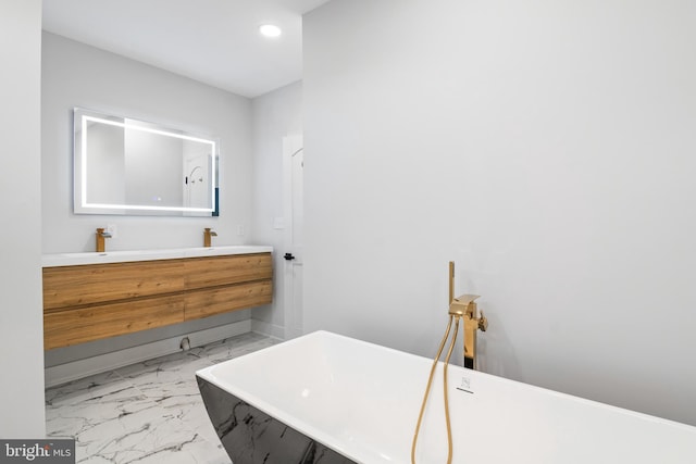 bathroom with vanity and a bathtub