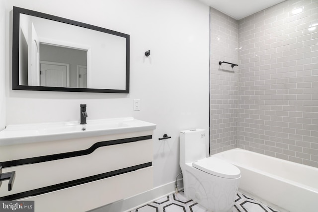 full bathroom with tiled shower / bath, vanity, and toilet