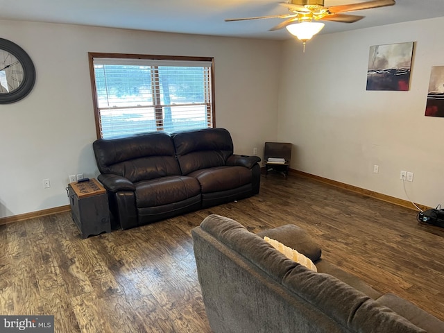 living room featuring ceiling fan and dark hardwood / wood-style flooring