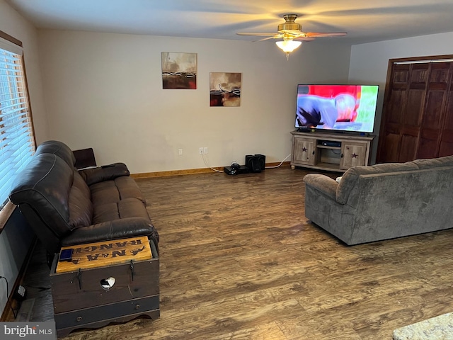 living room featuring hardwood / wood-style flooring and ceiling fan