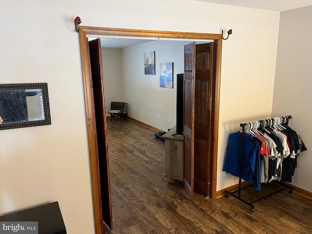 corridor with dark wood-type flooring