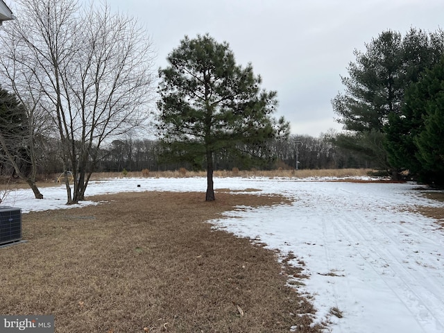 yard layered in snow with cooling unit