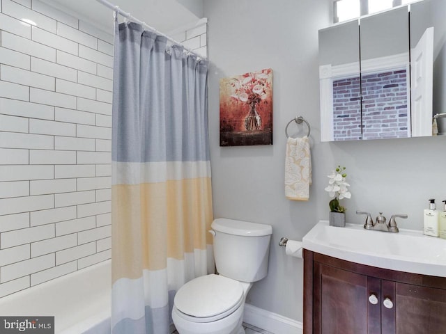 full bathroom with vanity, toilet, and shower / tub combo