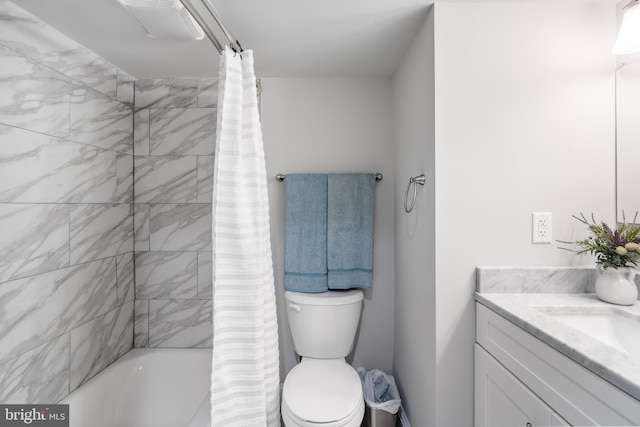 full bathroom featuring toilet, vanity, and shower / bathtub combination with curtain