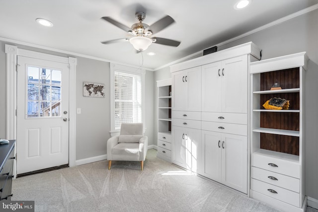 sitting room featuring crown molding, light carpet, and ceiling fan