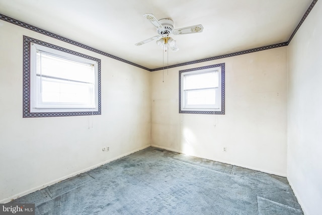 spare room with carpet floors and ceiling fan