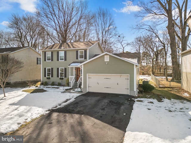 view of front of property with a garage