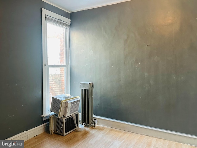 unfurnished room with hardwood / wood-style floors