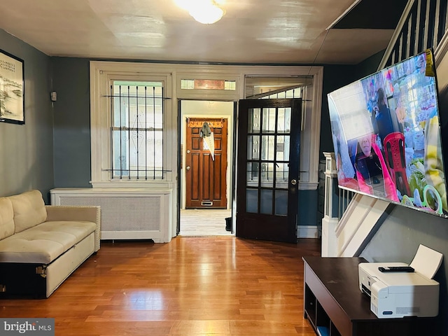 entryway featuring radiator and hardwood / wood-style floors