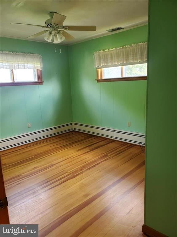 empty room featuring ceiling fan and light wood-type flooring