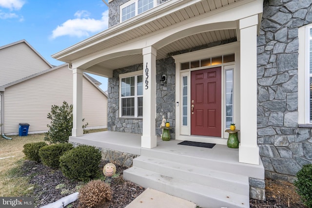 property entrance with covered porch