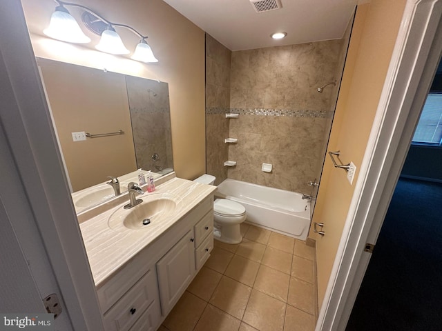 full bathroom with vanity, toilet, tiled shower / bath combo, and tile patterned flooring