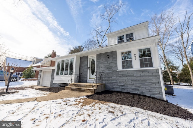 view of front of property with a garage